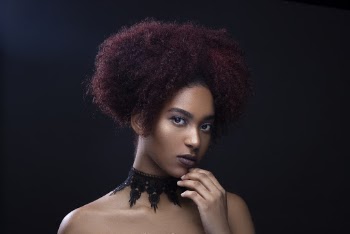Photo Of Woman Wearing Black Necklace