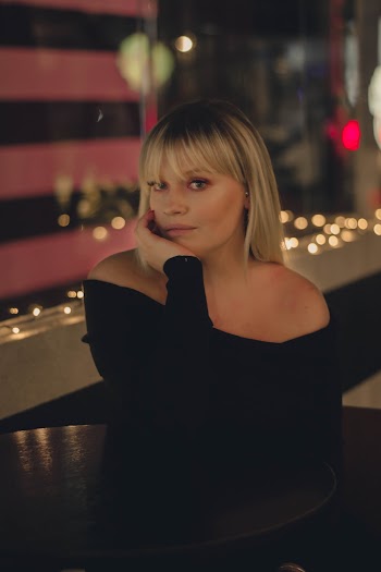Photo Of Woman Wearing Black Off-Shoulder