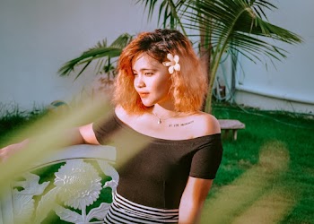 Photo of Woman Wearing Black Off Shoulder Dress