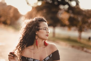 Photo of Woman Wearing Black Off-shoulder Top