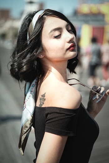 Photo Of Woman Wearing Black Off Shoulder top