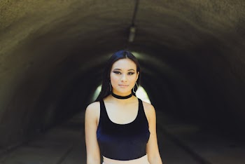 Photo of Woman Wearing Black Scoop-neck Tank Top