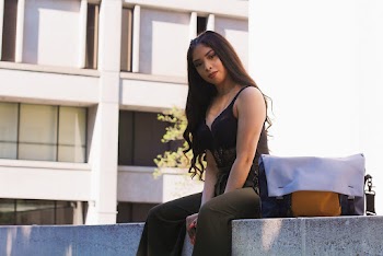 Photo of Woman Wearing Black Spaghetti Strap Top
