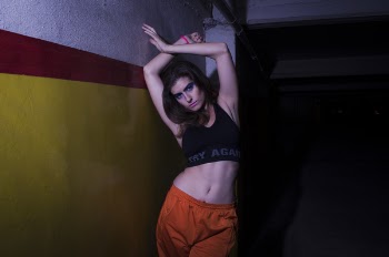 Photo of Woman Wearing Black Sports Bra