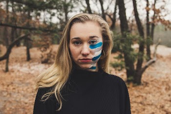 Photo of Woman Wearing Black Sweater