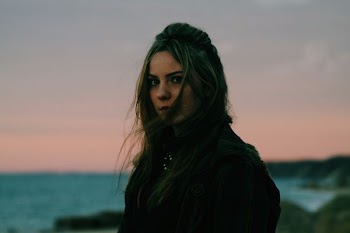 photo of woman wearing black top