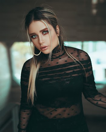 Photo of Woman Wearing Black Top