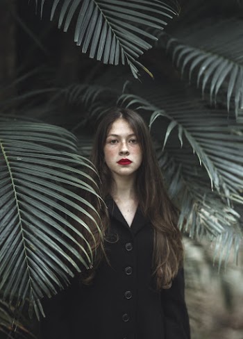 Photo of Woman Wearing Black Top