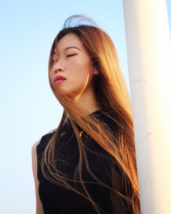 Photo Of Woman Wearing Black Top