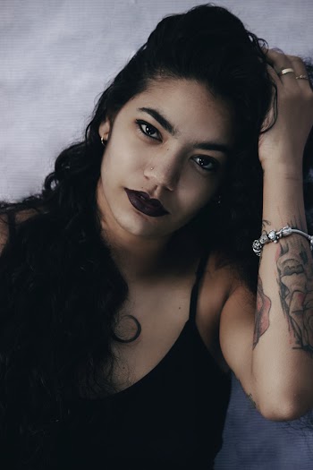 Photo of Woman Wearing Black Top