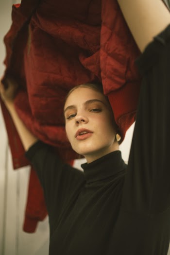 Photo of Woman Wearing Black Turtleneck Top