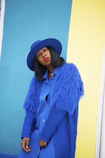Photo Of Woman Wearing Blue Coat