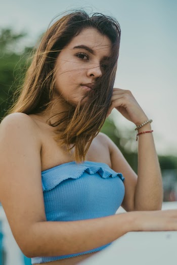 Photo of Woman Wearing Blue Crop Top