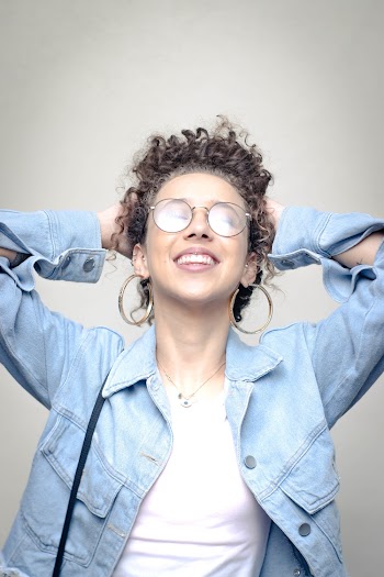 Photo of Woman Wearing Blue Denim Jacket