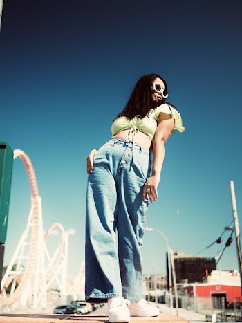 Photo Of Woman Wearing Blue Denim Jeans