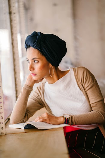 Photo of Woman Wearing Blue Headdress