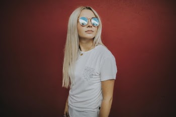 Photo of Woman Wearing Blue-lens Sunglasses