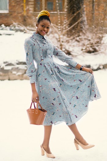 Photo of Woman Wearing Blue Long-sleeved Dress