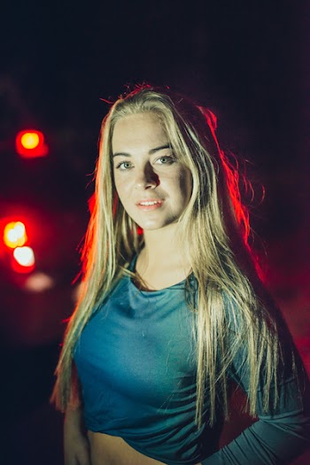 Photo of Woman Wearing Blue Long-sleeved Shirt