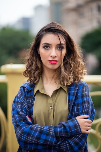 Photo of Woman Wearing Blue Plaid Shirt