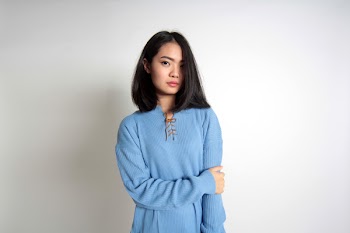 Photo of Woman Wearing Blue Sweater