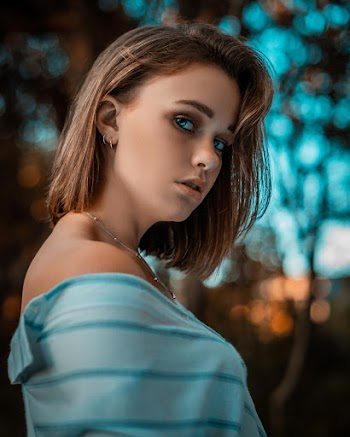 Photo of Woman Wearing Blue Top