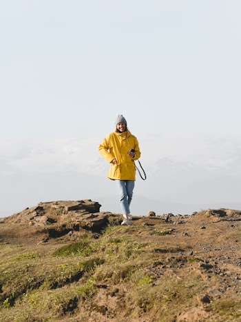 Photo of Woman Wearing Bonnet and Yellow Jacket