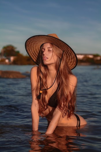 Photo of Woman Wearing Brown Hat