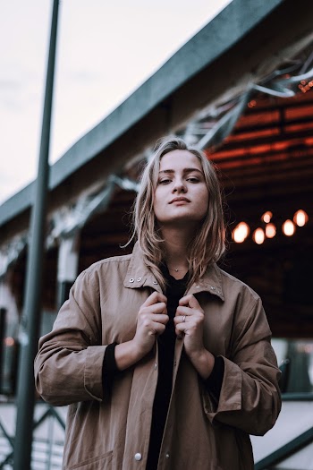 Photo Of Woman Wearing Brown Jacket