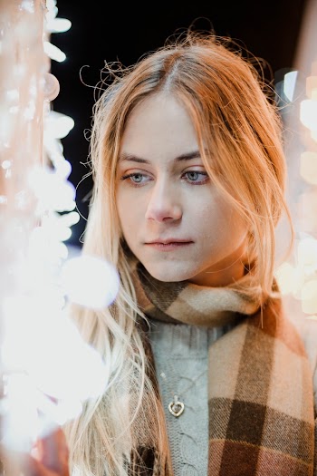 Photo Of Woman Wearing Brown Scarf
