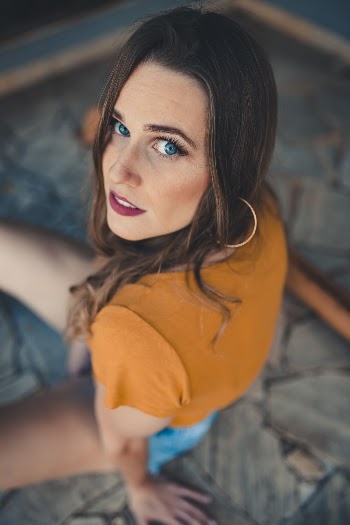 Photo of Woman Wearing Brown Shirt