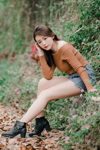 Photo Of Woman Wearing Brown Sweater