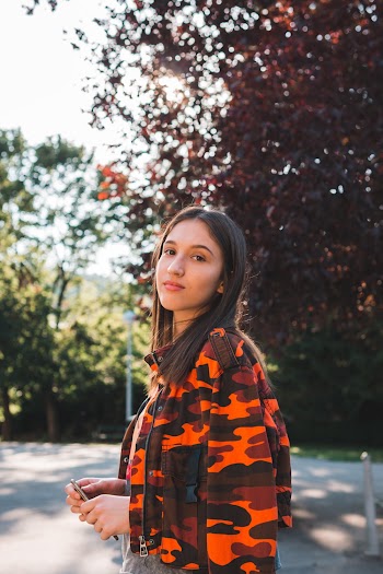 Photo Of Woman Wearing Camouflage Jacket