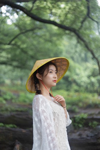 Photo Of Woman Wearing Conical Hat