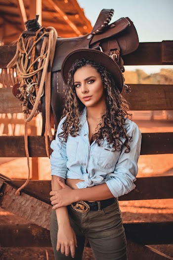 Photo of Woman Wearing Cowboy Hat