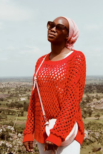 Photo Of Woman Wearing Crocheted Sweater