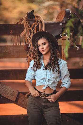 Photo of Woman Wearing Crop Top and Cowboy Hat