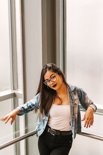 Photo of Woman Wearing Denim Glasses