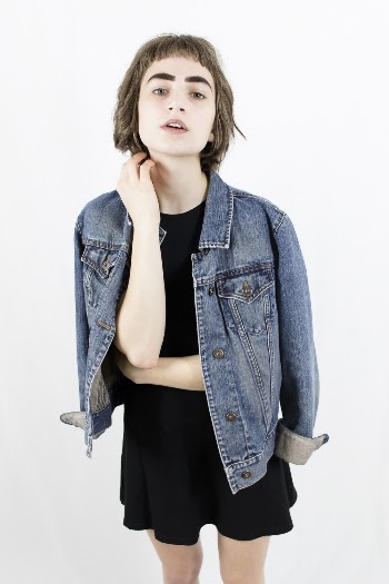 Photo of Woman Wearing Denim Jacket