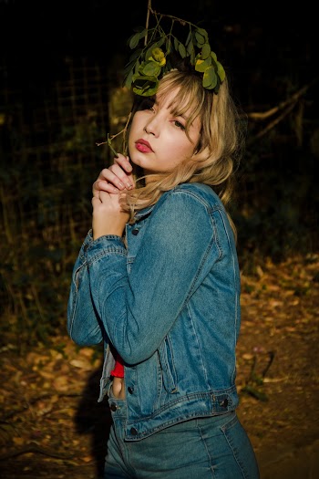 Photo Of Woman Wearing Denim Jacket