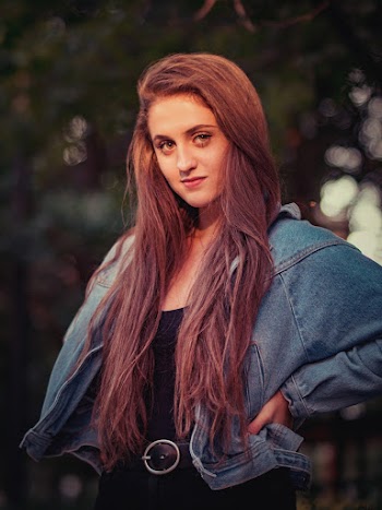 Photo of Woman Wearing Denim Jacket