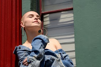 Photo of Woman Wearing Denim Jacket