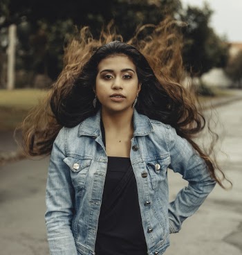 Photo Of Woman Wearing Denim Jacket