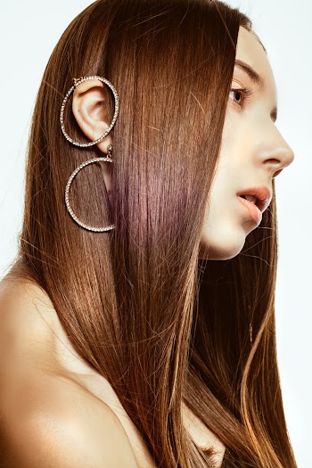 Photo Of Woman Wearing Earings