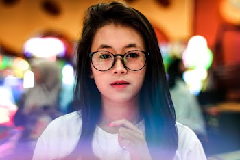 Photo of Woman Wearing Eyeglasses