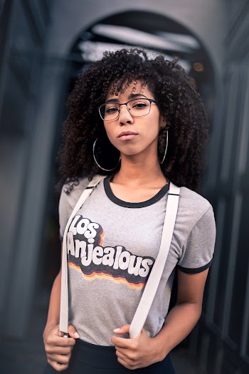 Photo of Woman Wearing Eyeglasses