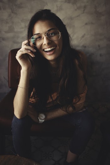 Photo of Woman Wearing Eyeglasses