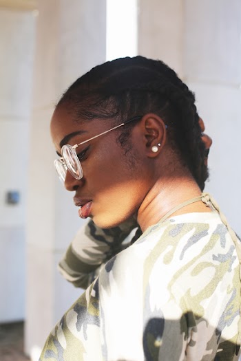 Photo of Woman Wearing Eyeglasses