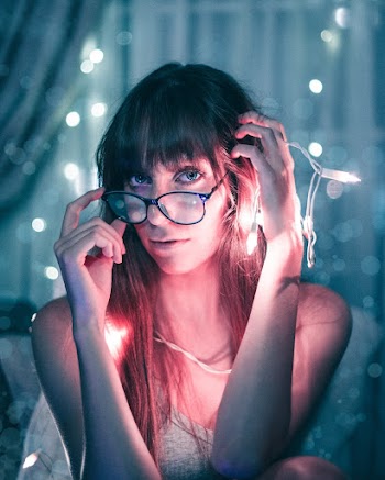 Photo of Woman Wearing Eyeglasses