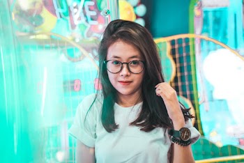 Photo of Woman Wearing Eyeglasses